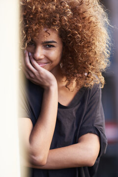 young trendy woman with curly hair