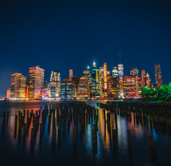 Fototapeta na wymiar city skyline at night New York beautiful reflections buildings cityscape 