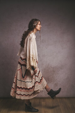 A bohemian woman walking