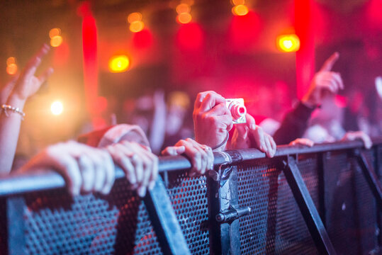 a person taking a picture at a concert