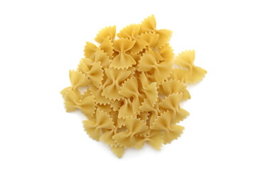 Pasta in the form of a bow lie in one heap on a white background