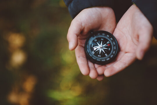 Child't hands with compass
