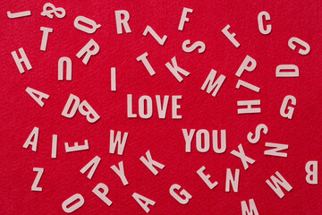 Many letters  leather mixed, with I Love You alphabet in the center on red background,I love you concept.