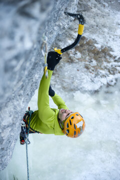 Man climbing with ice axes
