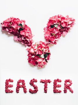 Bunny face made of flowers and word Easter written below it