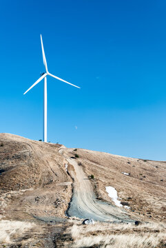 Wind turbine on blue sky