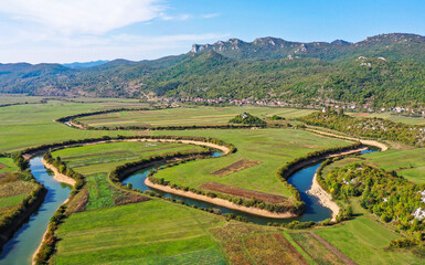 SEPTEMBER, 2020 - Aerial view of river Lika meandering through Donji Kosinj and Lipovo Polje villages in Croatia.