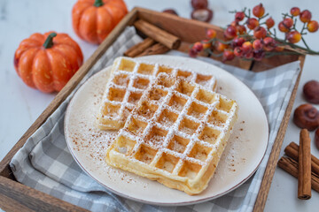 sweet home made pumpkin spice waffles on a table