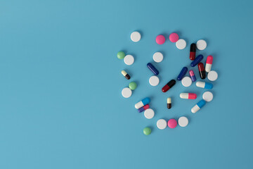 medicine pills on blue background Copy space for text Assorted pharmaceutical Healthy Eating, Lifestyle.