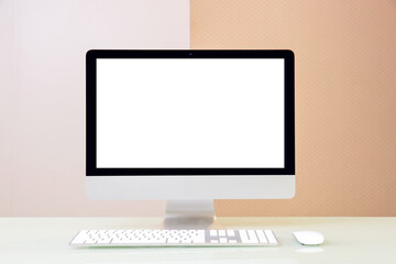 Workspace,Computer Monitor with white blank screen on a table in office room.