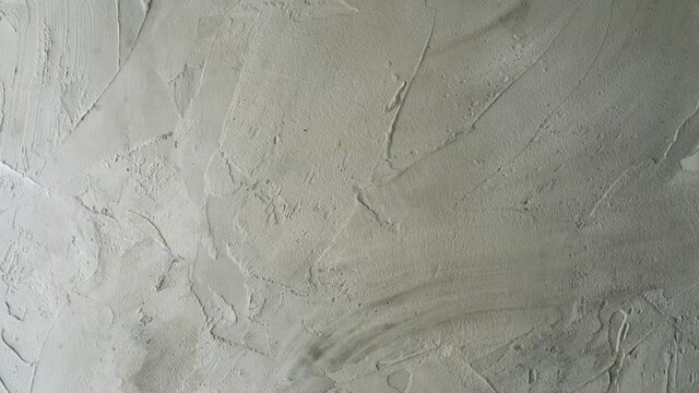 Stacked wall surface painted white. Texture, background. Macro shooting, camera slowly moving on slider.