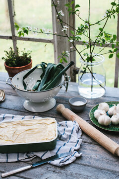 Kitchen scene with a filo pie ready for baking.