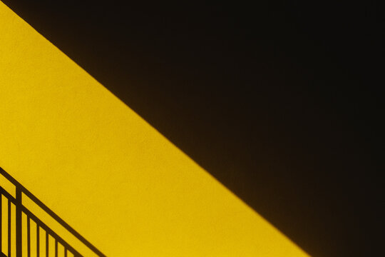 Abstract shadows on yellow wall