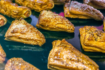 Sweet toppings with filling. The rolls are coated with sugar icing.