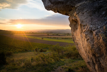 Sunset at a massive boulder called Hoelzlstein in Burgenland