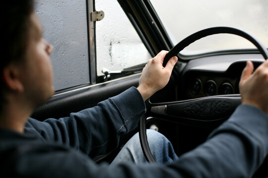 man driving a car