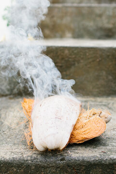 Balinese coconut husk burning to ward off evil spirits