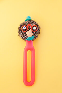 Creating faces from household cleaning equipment / products