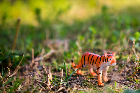 Miniature Plastic Toy Tiger in grass