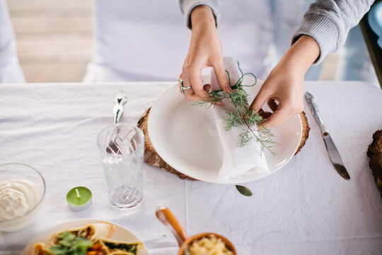 Woman prepare table decoration for dinner party