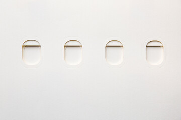 Airplane windows cut out of paper