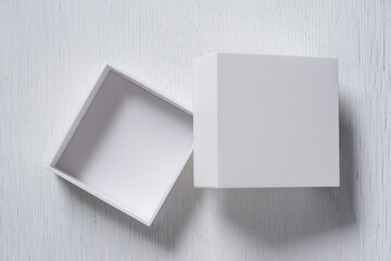 Cardboard box with cover on white table top view, Open gift box.