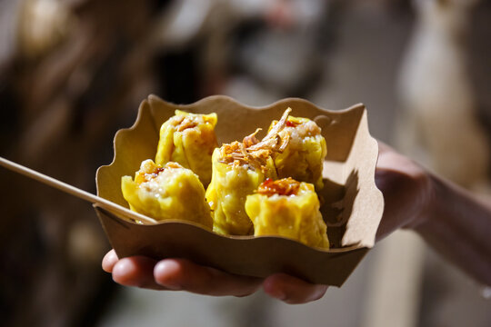 Shumai or Kanom Jeeb or Steamed Pork and Shrimp Dumplings in street food night market