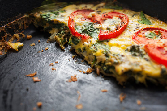Breakfast omelette in cast iron skillet.