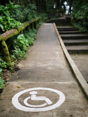 The wheelchair symbol on the way up to the hill