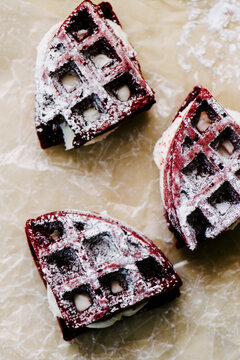 Red Velvet Cake Waffles Sandwiches On Parchement Paper