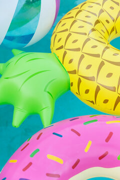 Colorful pool floats in the pool.