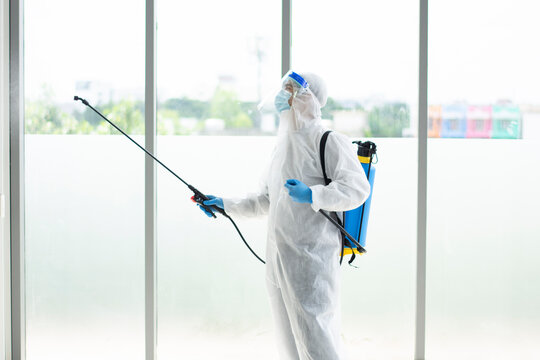 Employees  sterilize covic 19 cleaning virus on office,teamwork for cleaning meetroom