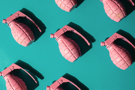 Organised pink had grenades on blue background.