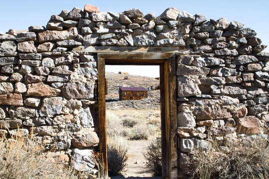 Peering Through Door Frame of Decaying Ghost Town Buildling