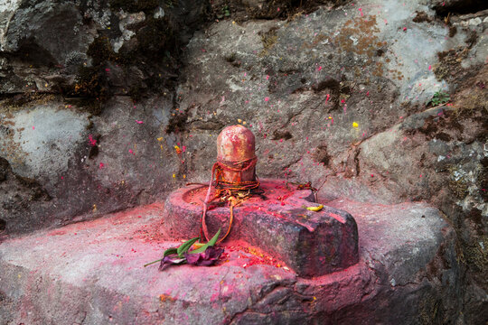Shiva Ling covered in vermillion.