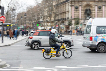 Paris, France; January 10, 2020: Classic nice moped running in the city. 