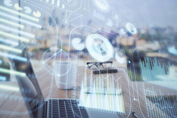 Double exposure of desktop computer and technology theme hologram. Concept of software development.