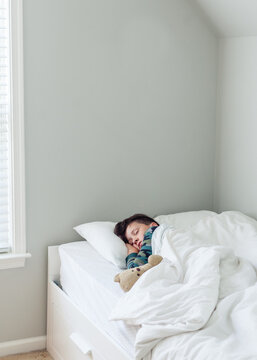 Boy sleeping in his room
