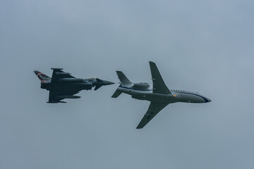 Fototapeta na wymiar air show with pursuit from jet and plane