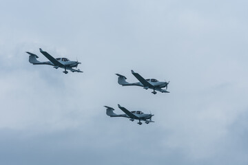 three planes in formation at a air show