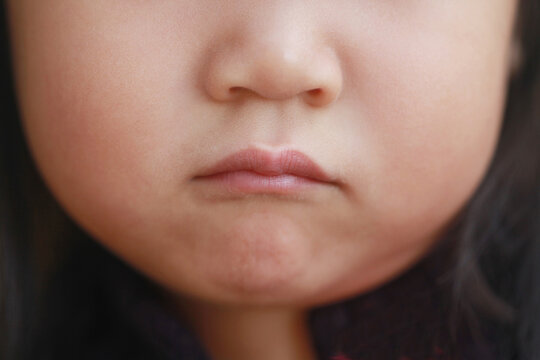 Lower Portion of Asian Girl's Face With Pouting Mouth