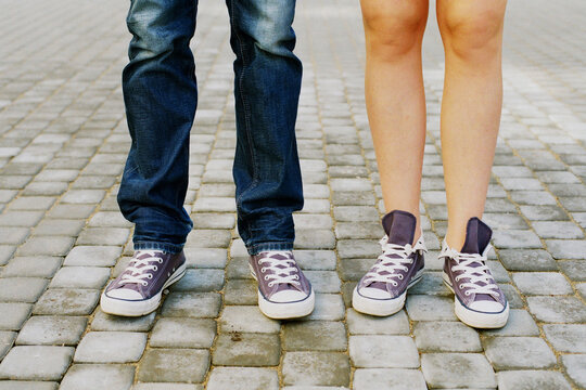 Couple wearing same sneakers
