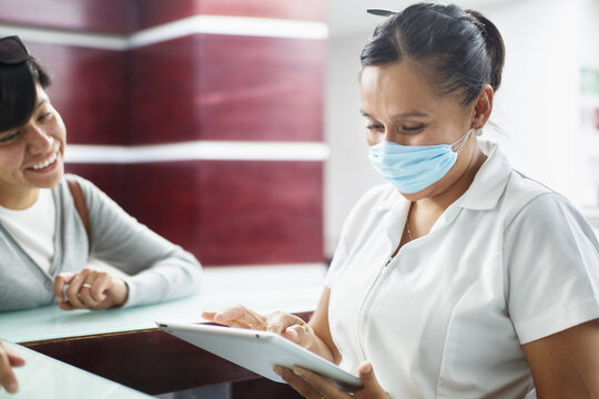 Patient And Nurse With A Tablet Talking