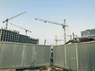 construction site. dangerous sections of the construction site are fenced with a metal gray sheet....