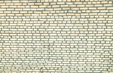 white brick wall. texture of small, bleached, concrete bricks. graphic decoration of the building wall. stylish design renovation. painted surface