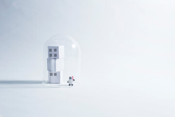 A lone astronaut waves from a bio dome...