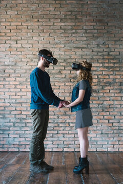 Couple at home using VR Reality viewer