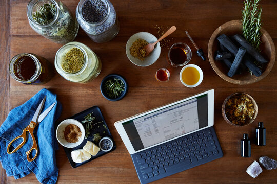 Digital Tablet with spreadsheet on it surrounded by skincare products