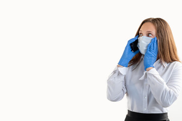 Covid-19 restriction. Business problems. Mobile communication. Scared office woman in protective mask gloves talking by phone looking copy space isolated on white. Advertising background