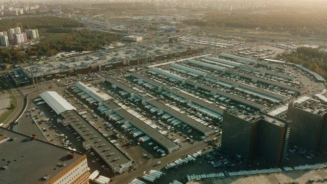 Aerial shot of a major wholesale commercial centre full of trailer trucks loading at warehouse bays